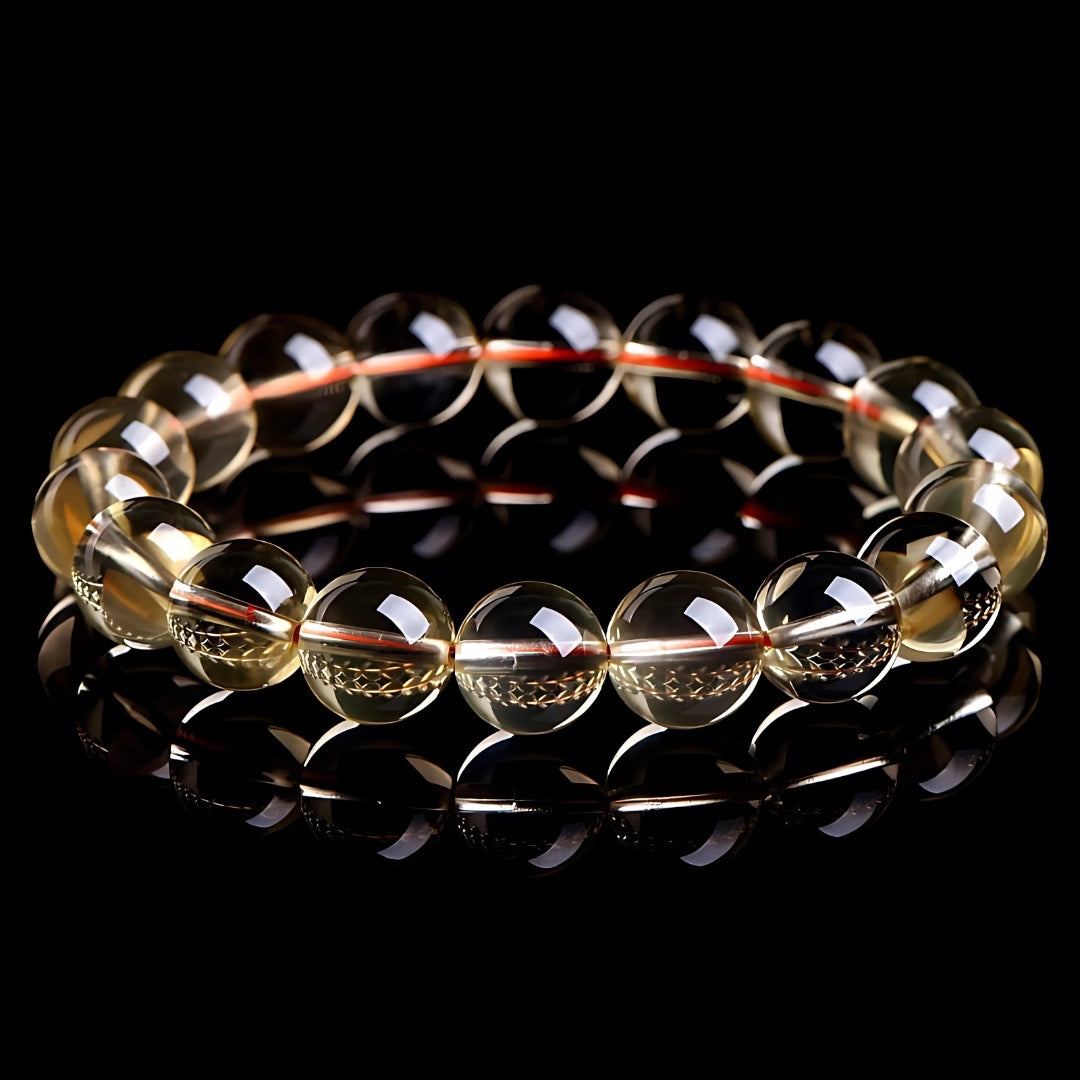 Charmluna polished yellow citrine gemstone bead stretch bracelet with translucent quartz beads on a black background.