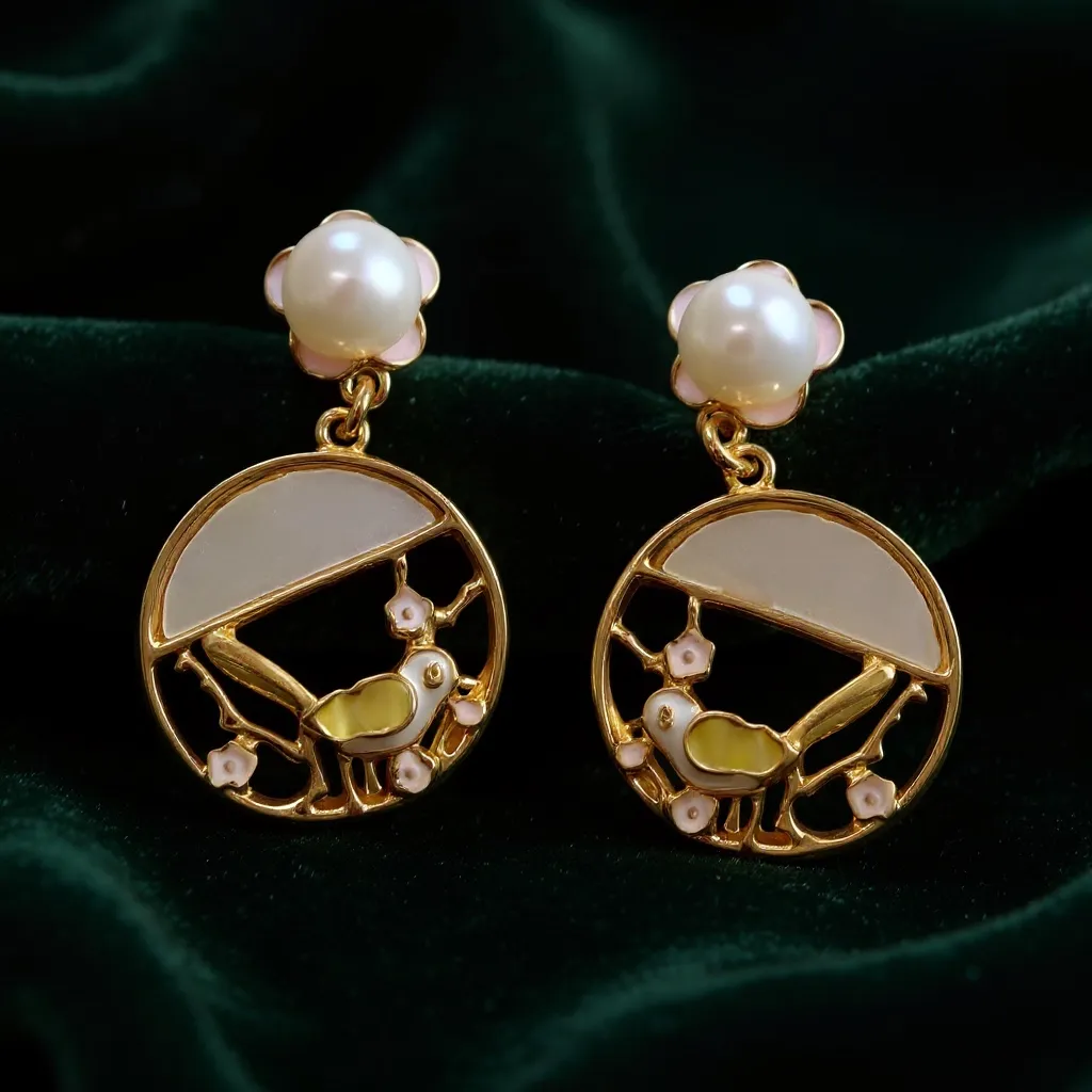 Charmluna gold-tone drop earrings featuring a bird and floral enamel design with a cream faux pearl stud.