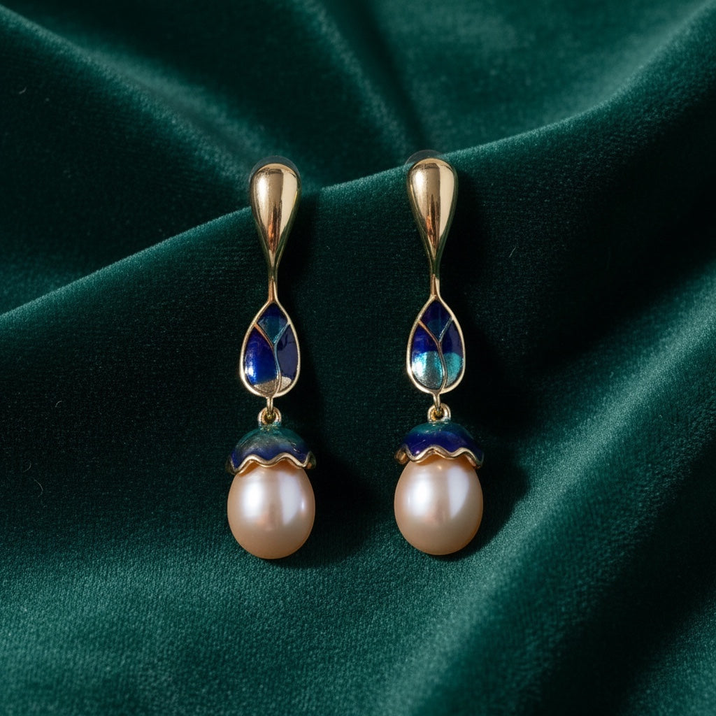 Charmluna long drop earrings featuring gold accents, blue and green enamel details, and elegant pearl drops.