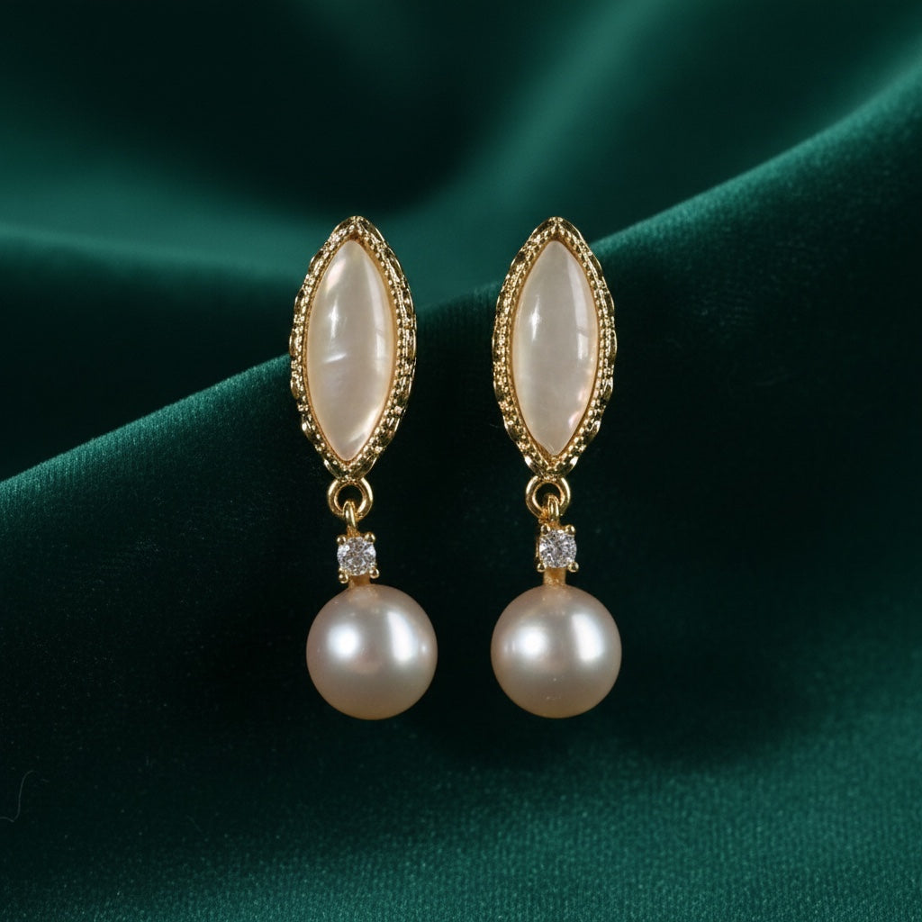 Charmluna marquise drop earrings featuring iridescent cabochons, crystal accents, and round pearls in gold-tone metal.